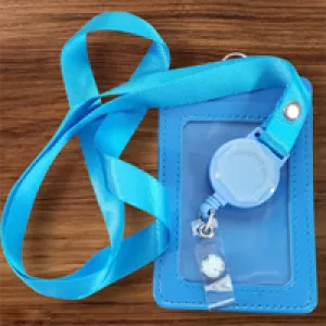Interchangeable Badge Reel Lanyard with Retractable Reel: Lanyard Light Blue.  Badge Button: Light Blue with darker snowflakes. Our Interchangeable Badge Reels are made to be used with our Interchangeable Badge Reel Charms. RSV